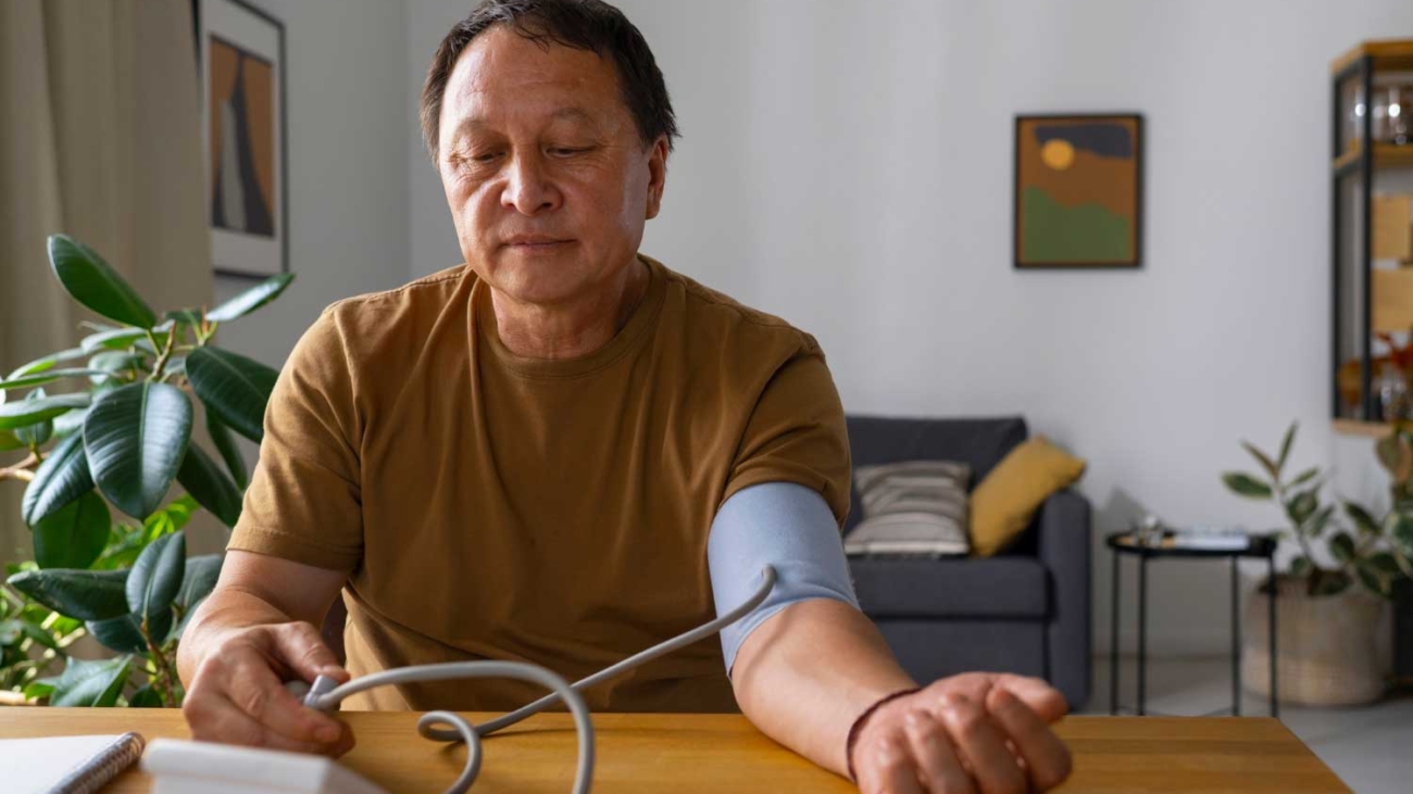 portrait-older-man-checking-blood-pressure-home